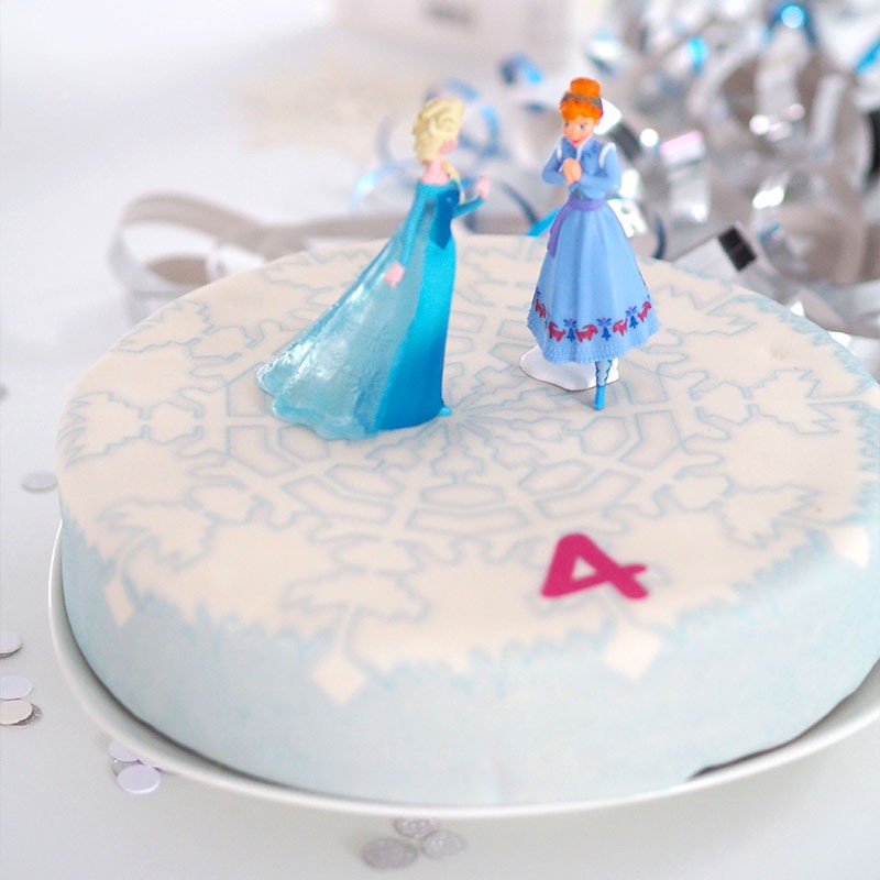 Anna und Elsa von die Eiskönigin® auf Schneeflocken-Torte 