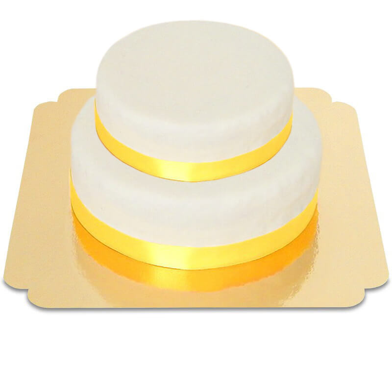 Zweistöckige weiße Torte mit Tortenband gelb
