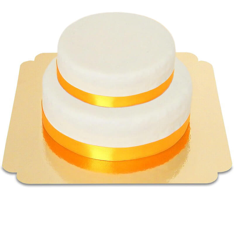 Zweistöckige weiße Torte mit Tortenband gold-gelb
