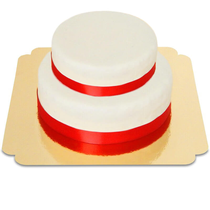 Zweistöckige weiße Torte mit Tortenband rot